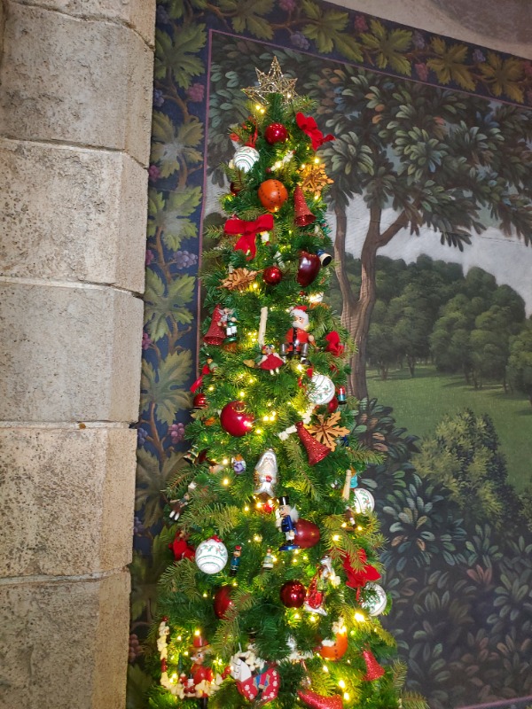 Mural and Christmas tree at the Germany pavilion at EPCOT's World Showcase